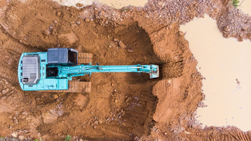 Is it better to buy a new or used excavator?